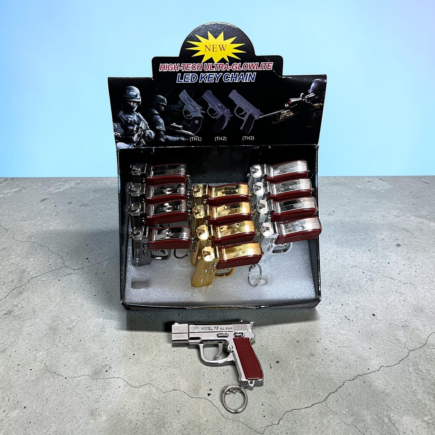 BRELOK PISTOLET LATARKA Z LASEREM.